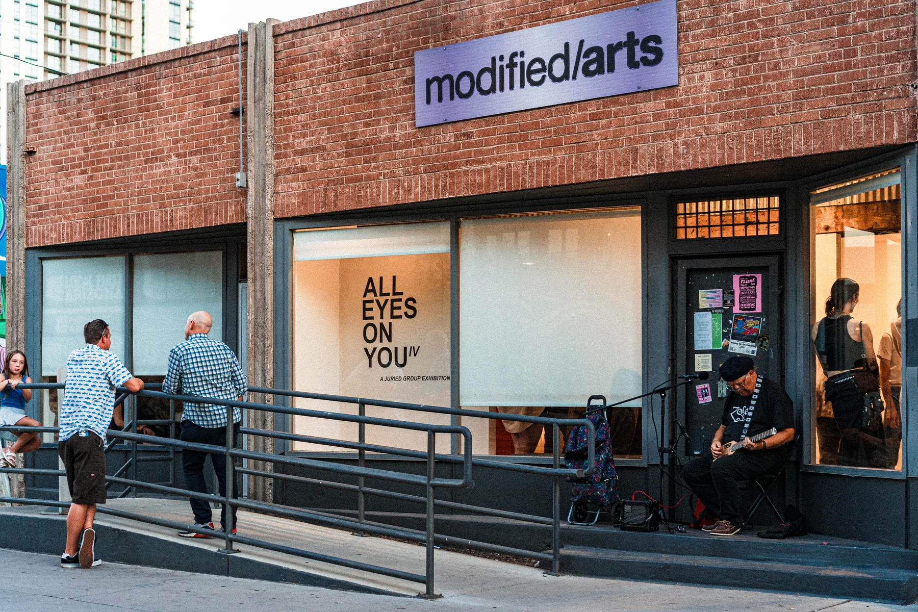 Visitors outside Eye Lounge Gallery during the opening of All Eyes On You IV.