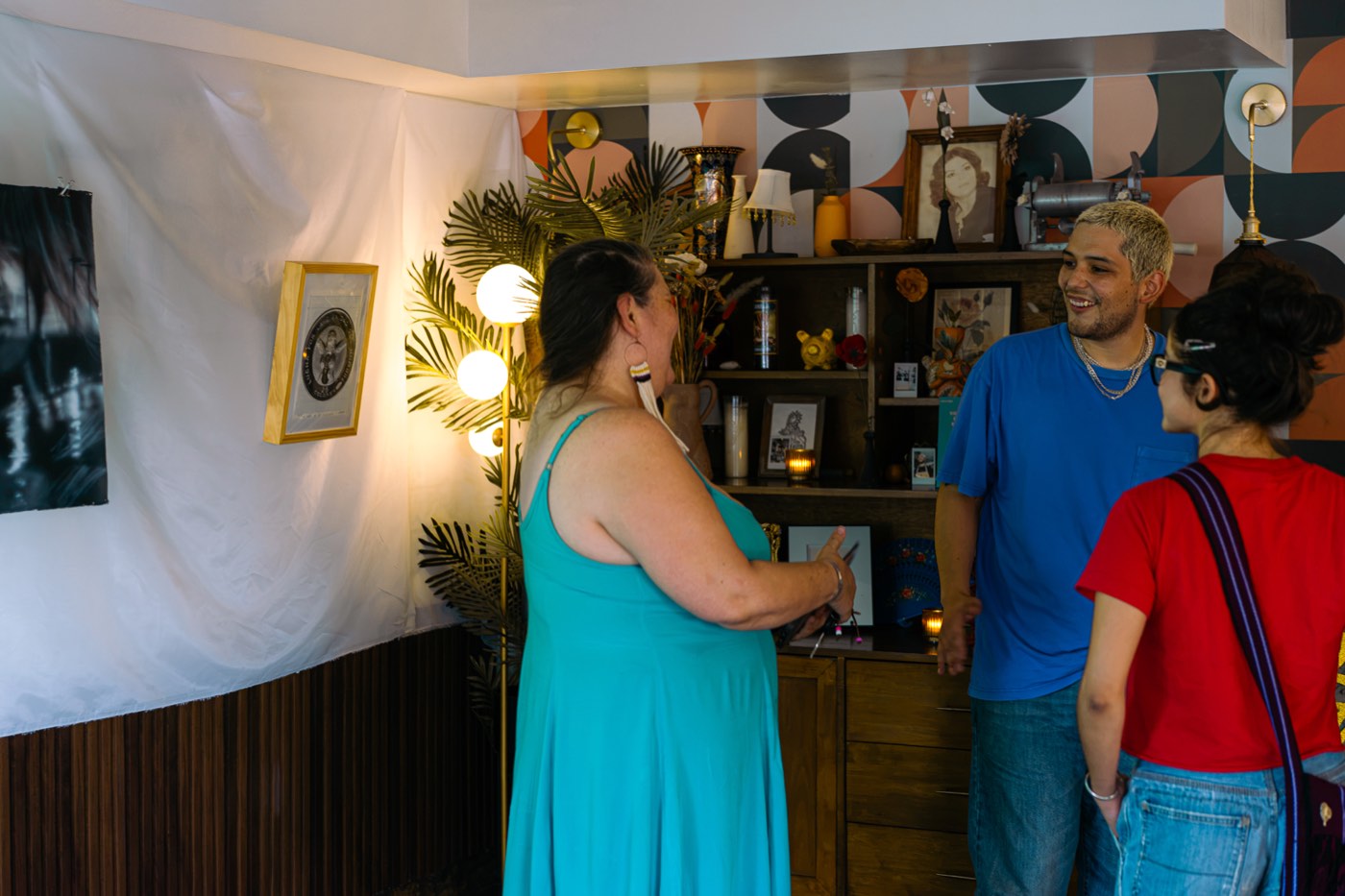 Visitors viewing artwork in the Simbiosis exhibition at Chilte.