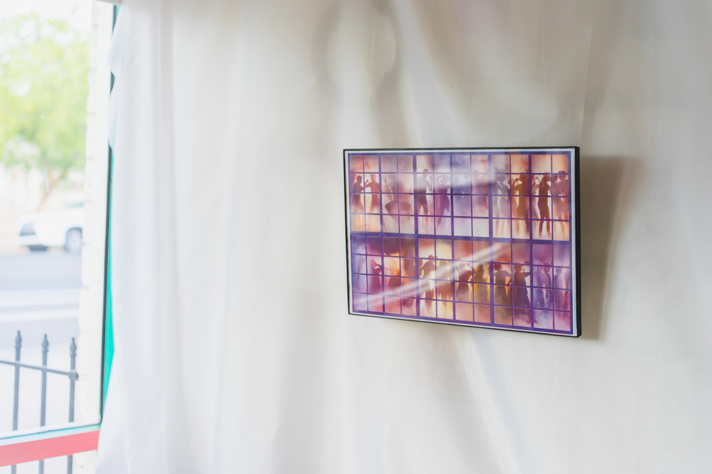 A framed photographic artwork installed near a window at Chilte for the Simbiosis exhibition.