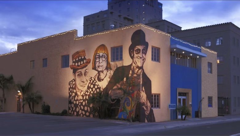 First Studio exterior with a large mural of local creative figures.