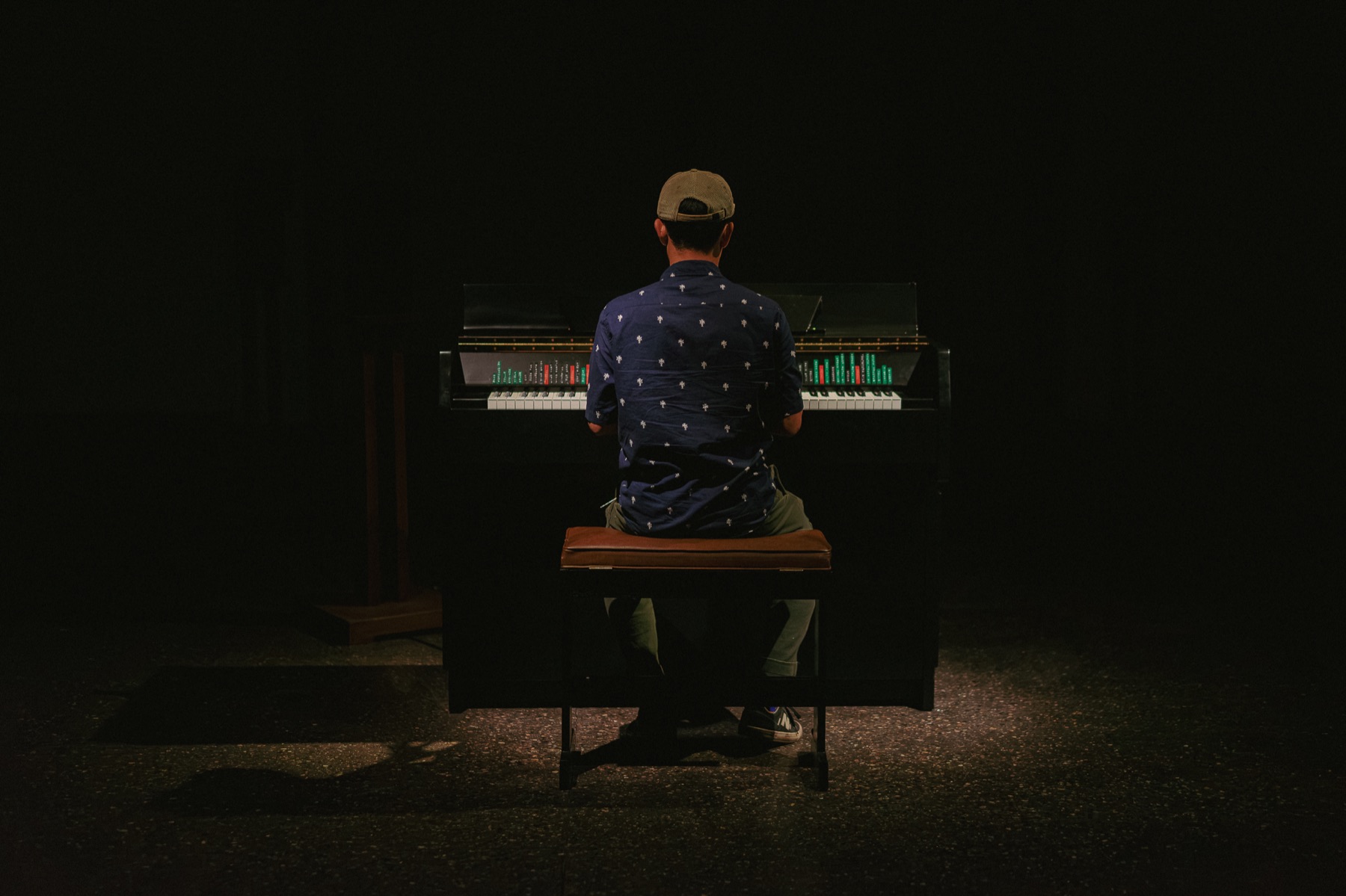 A visitor playing The Instrument of Troubled Dreams at Phoenix Art Museum.