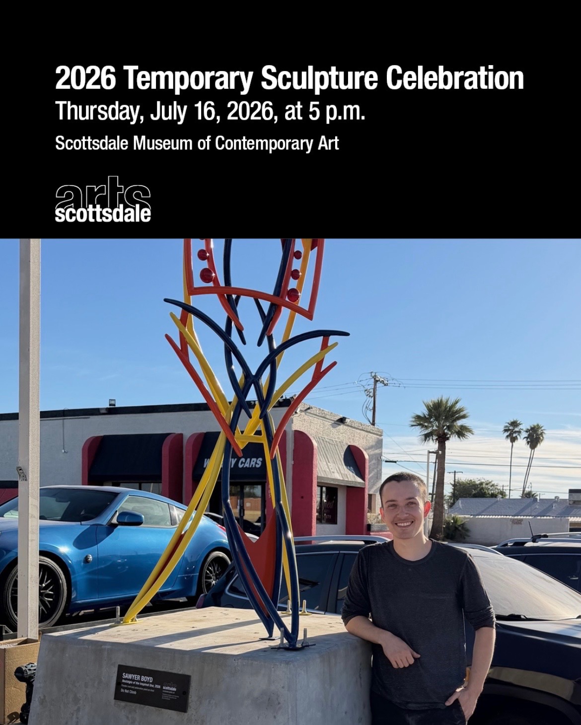 Sawyer Boyd standing beside his temporary sculpture Nostalgia of the Inspired One.